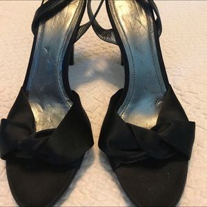 Pair of black Coach pumps.